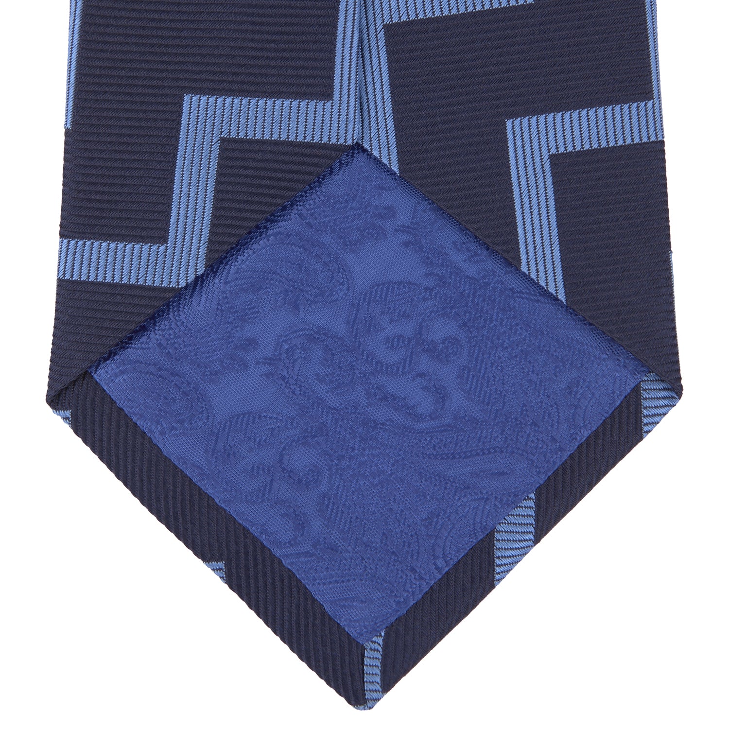 View 4 of product The Turnbull & Asser Navy and Light Blue Striped Zigzag Silk Tie features a striking zigzag pattern—a stylish accessory for the modern gentleman.