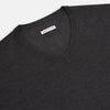 View 2 of product The Turnbull & Asser Charcoal Grey Merino V Neck Jumper is a classic long-sleeve knit with ribbed cuffs and hem, featured in our knitwear collection and shown against a white background.
