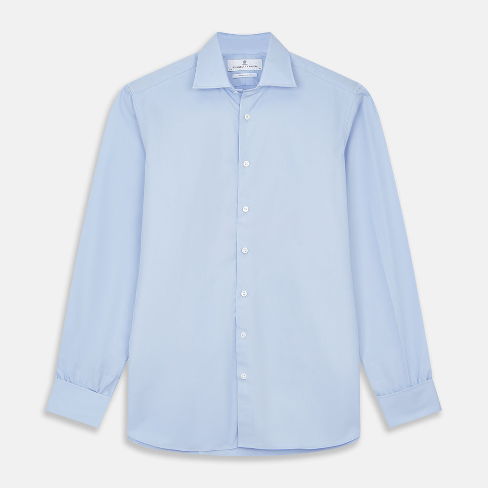 The Turnbull & Asser Tailored Fit Blue Cotton Shirt features a Kent collar and double cuffs—ideal for pairing with a navy suit for a sharp look.