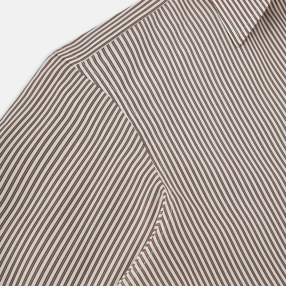 The Burgundy Halo Stripe Westminster Shirt by Turnbull & Asser features long sleeves, a button-up front, a Westminster collar, and thin vertical brown and white stripes, shown on a plain white background.