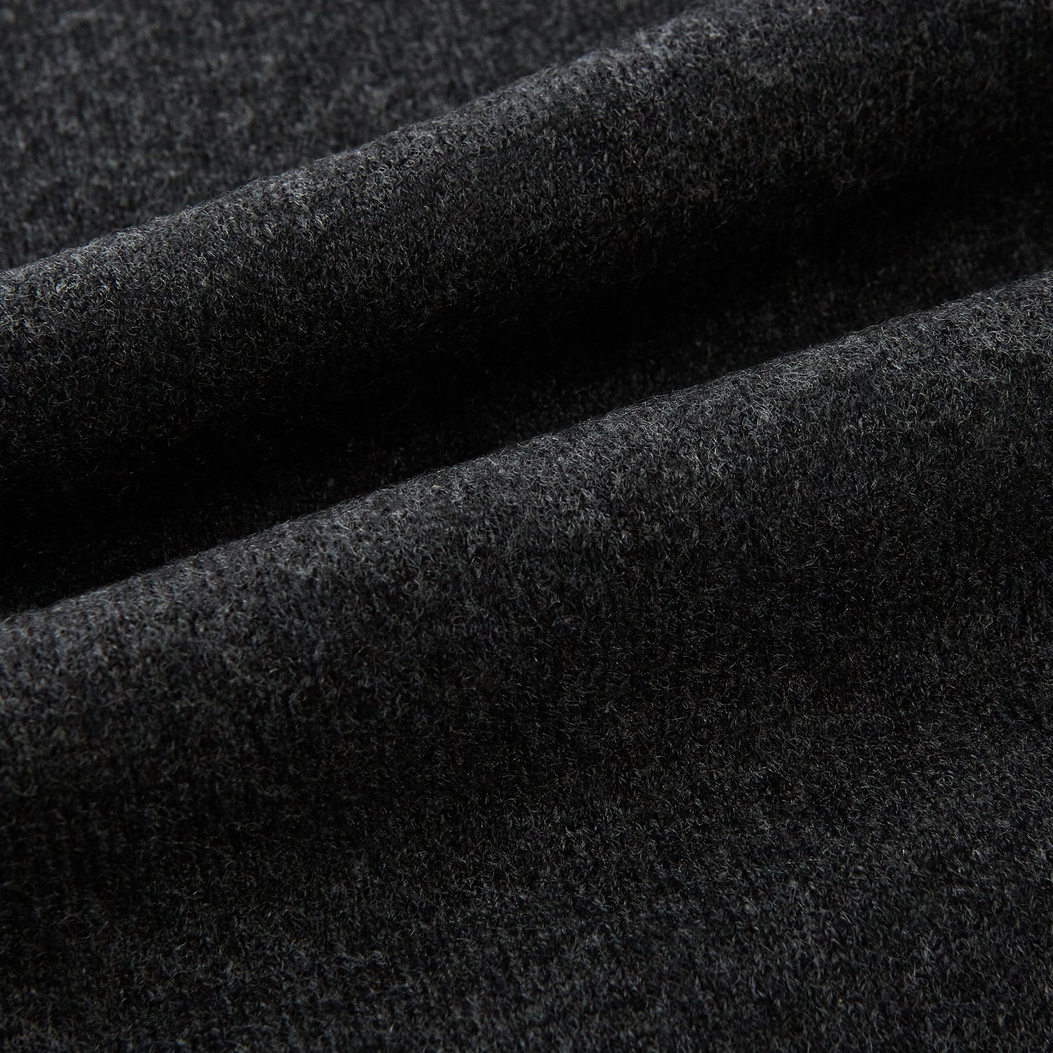 View 3 of product The Turnbull & Asser Plain Charcoal Cashmere Knitted Scarf, shown tied simply against a white background, is a classic luxury accessory perfect for any wardrobe.