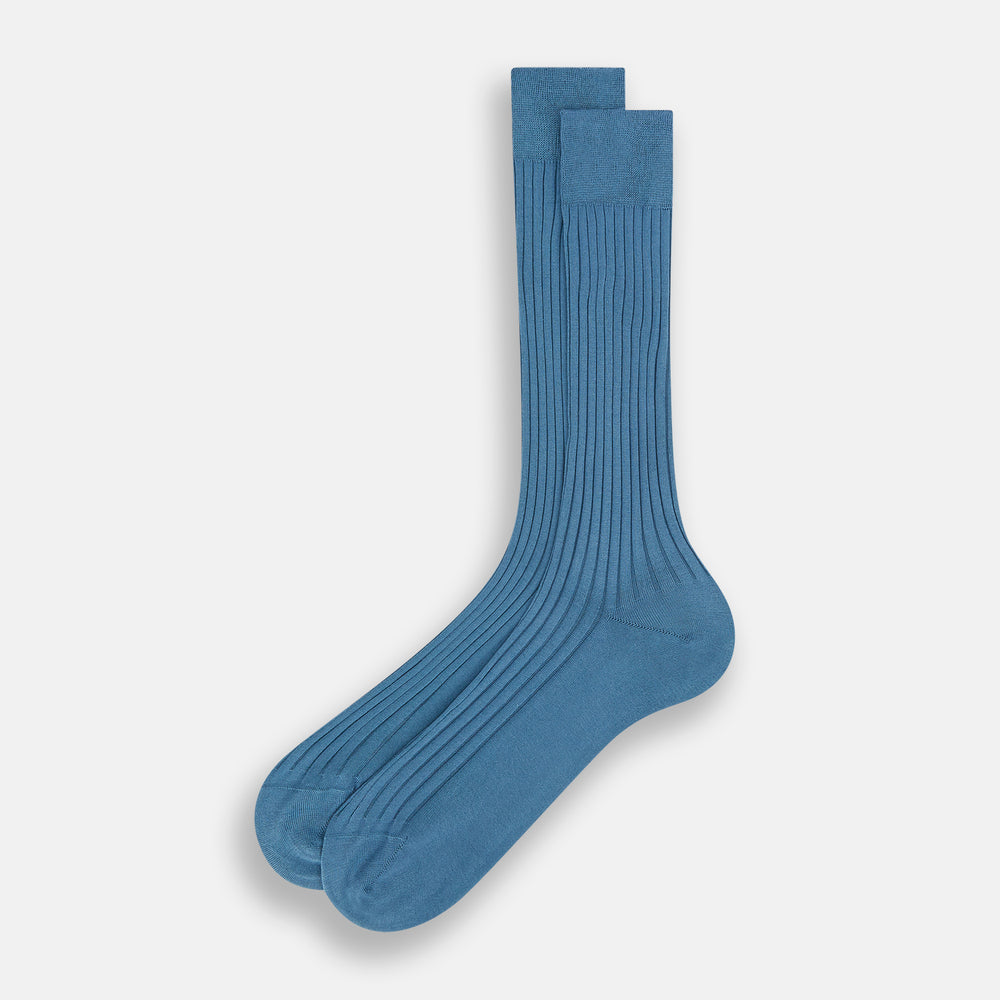 The Azzurro Organic Cotton Mid-Length Sock by Turnbull & Asser, featuring a ribbed texture in blue, is displayed against a plain white background.