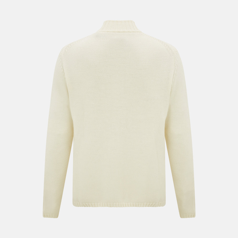 The White Merino High Neck Zipped Cardigan by Turnbull & Asser features a ribbed stand collar, cuffs, and hem. This elegant long-sleeve knitwear piece is shown on a plain white background.