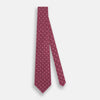 View 2 of product The Turnbull & Asser Burgundy Medallion Printed Silk Tie features small circular medallions and subtle light pink diagonal lines, crafted from fine English silk and displayed on a plain white background.
