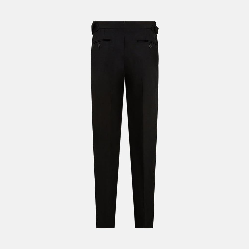 The Turnbull & Asser Black Single Breasted Dinner Suit, with satin lapels and matching trousers, is elegantly folded and displayed on a plain white background.