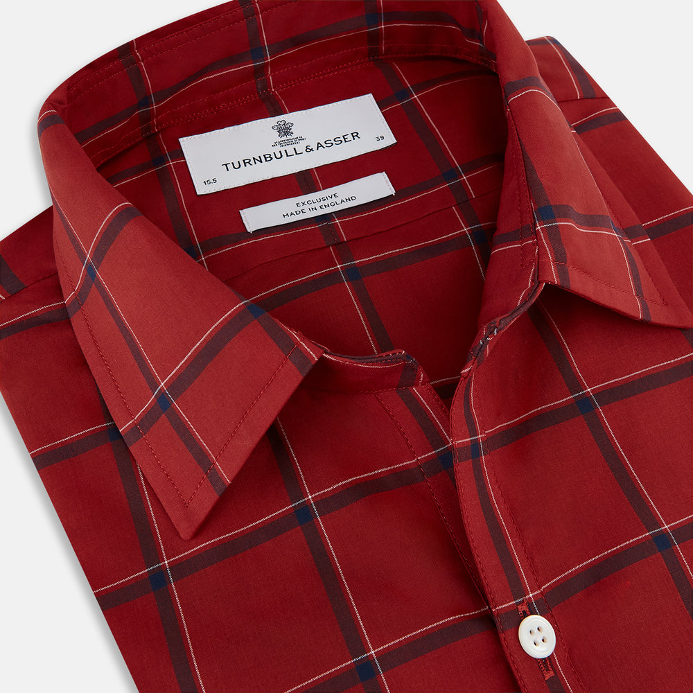The Turnbull & Asser Dark Red Grid Check Windsor Shirt is a long-sleeved, button-up shirt with a dark red base and black and white grid pattern, displayed flat on a white background.