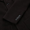 View 4 of product The Turnbull & Asser Dark Chocolate Knitted Cambridge Blazer for men, made from fine Italian wool with British tailoring, features a notched lapel, three front buttons, and three patch pockets, shown on a plain white background.