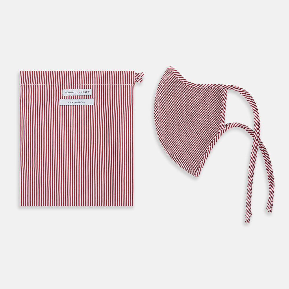 The Turnbull & Asser Burgundy Check Commuter Mask comes with 3 Viroformula™ filters. It features a check pattern, adjustable ear straps, and is displayed on a plain white background.