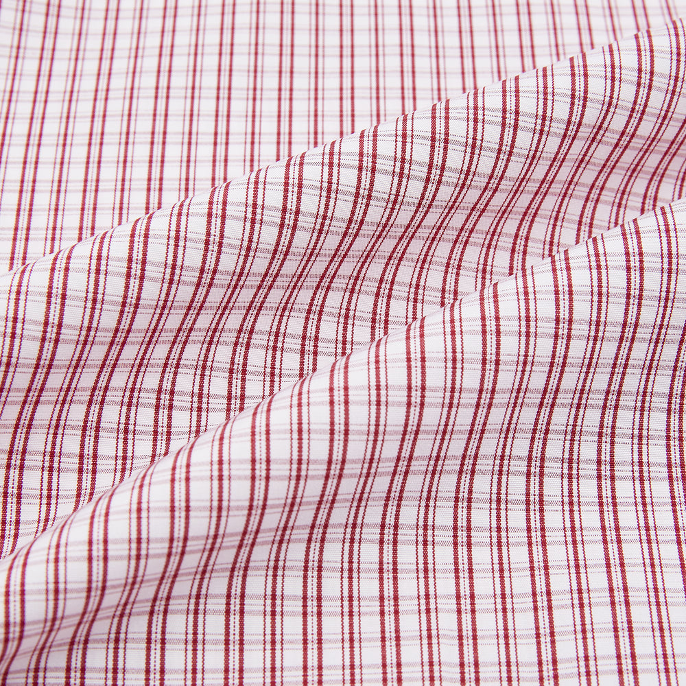 The Turnbull & Asser Red Micro Check Shirt features a crisp white contrast T&A collar and cuffs, crafted in Italian cotton. Timeless style is showcased against a plain white background, inspired by classic Turnbull & Asser designs.
