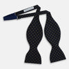 View 3 of product The Turnbull & Asser Lime Green and Navy Micro Dot Silk Bow Tie features small lime green dots on navy silk, displayed against a plain white background.