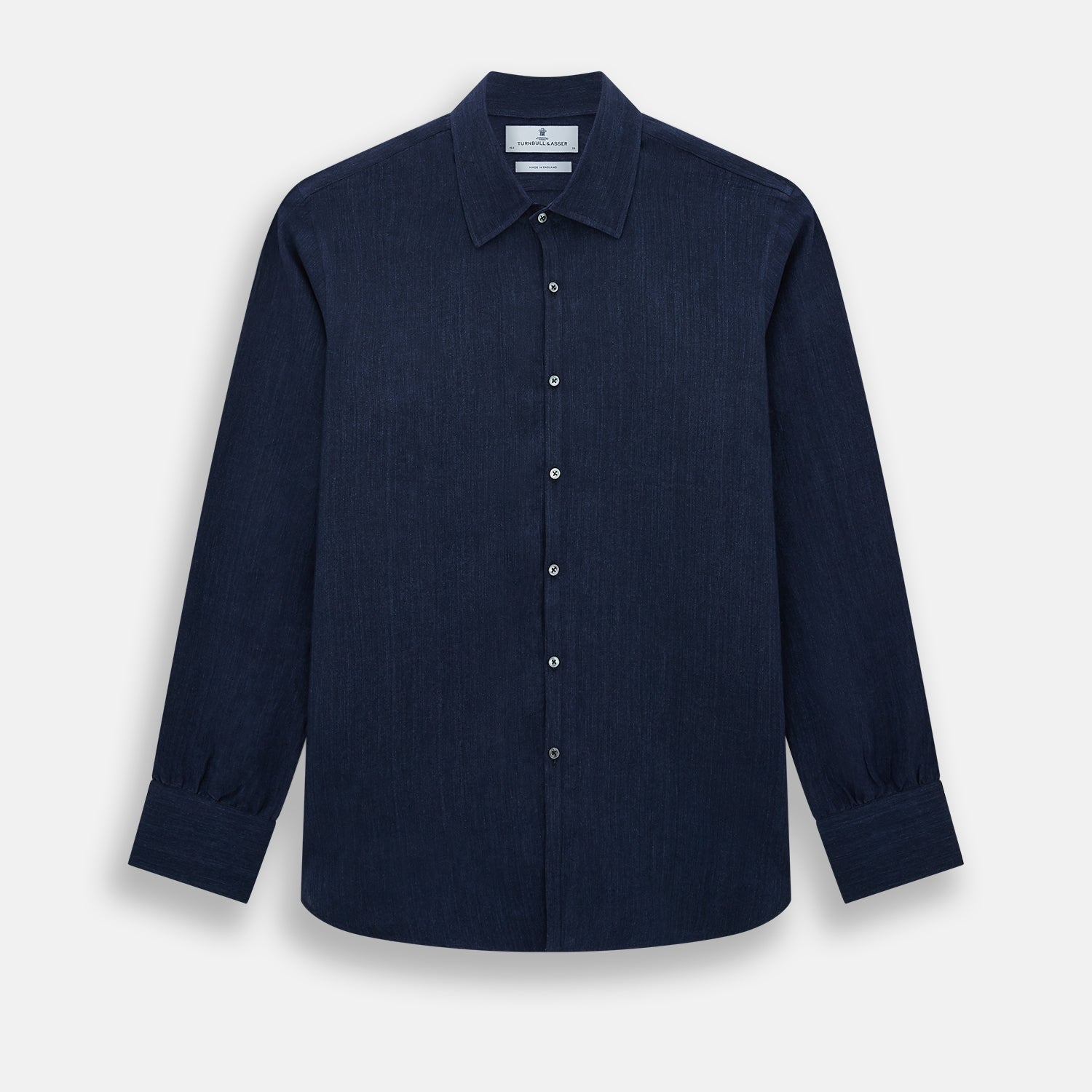 View 1 of product The Navy Linen Westminster Shirt by Turnbull & Asser features a classic collar and buttoned cuffs, exemplifying British craftsmanship. Shown here in long sleeves, the shirt is displayed flat against a white background.