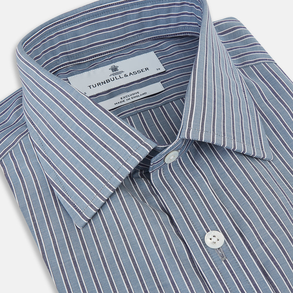 The Steel Grey Ticking Stripe Mayfair Shirt by Turnbull & Asser is a long-sleeved, button-up shirt with a collar, crafted from fine Italian cotton and featuring slim steel grey and white stripes with white buttons for a classic touch.