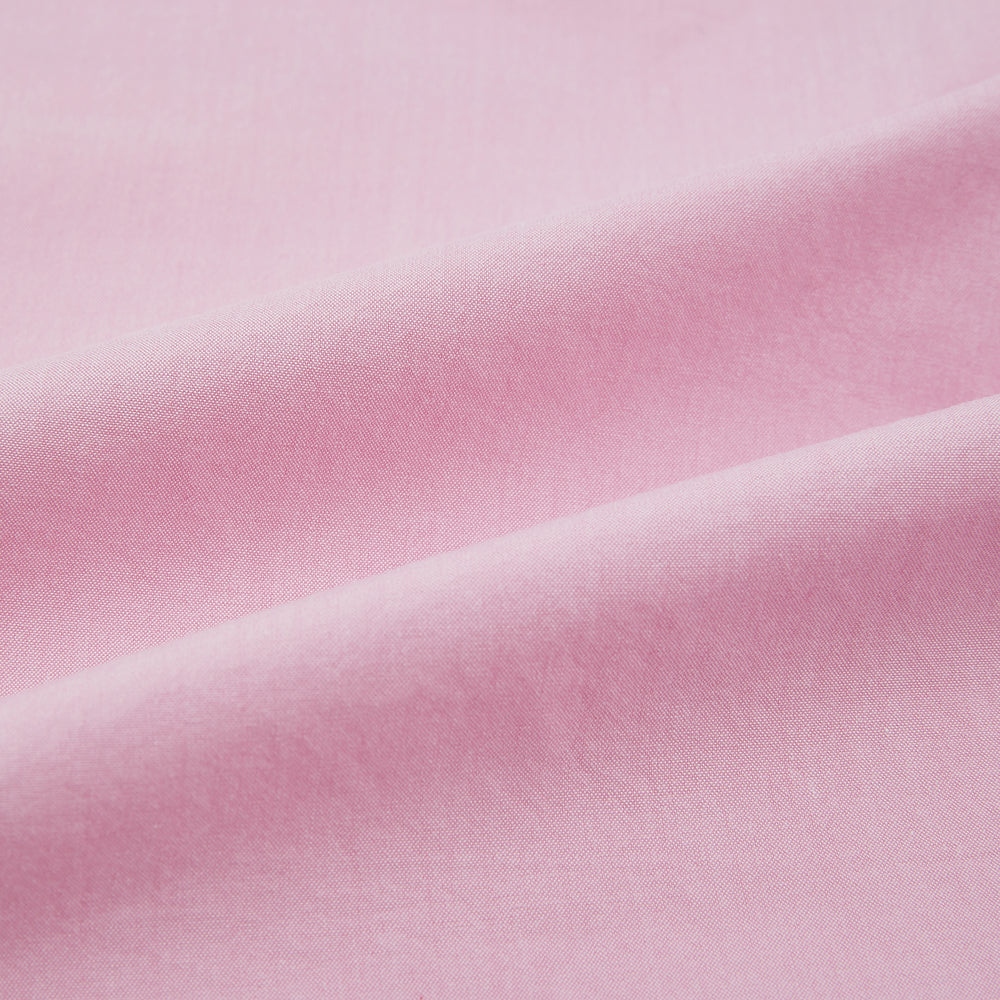 The Pink Hyde Overshirt by Turnbull & Asser is a long-sleeved, light pink sanforised cotton shirt with a left chest pocket and dark buttons—an elegant, laid-back alternative to a blazer.