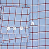 View 4 of product The Turnbull & Asser Blue and Burgundy Windowpane Mayfair Shirt features long sleeves, a light blue base with burgundy windowpane checks, a classic collar, and white buttons.