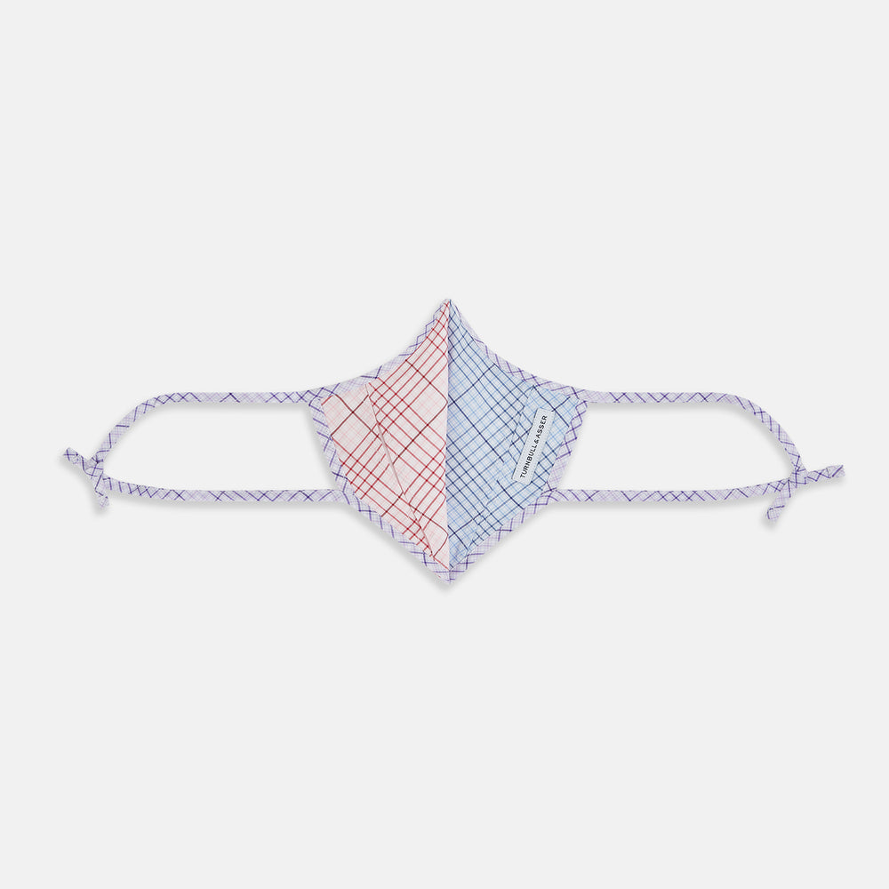 Introducing the Blue, Pink & Purple Checked Cotton Commuter Mask from Turnbull & Asser UK. This adjustable face covering features a vibrant checked pattern in blue, pink, and purple on soft cotton. The mask includes matching fabric straps finished with elegant bows at each end and comes with 3 VIROFORMULA™ filters for added protection.