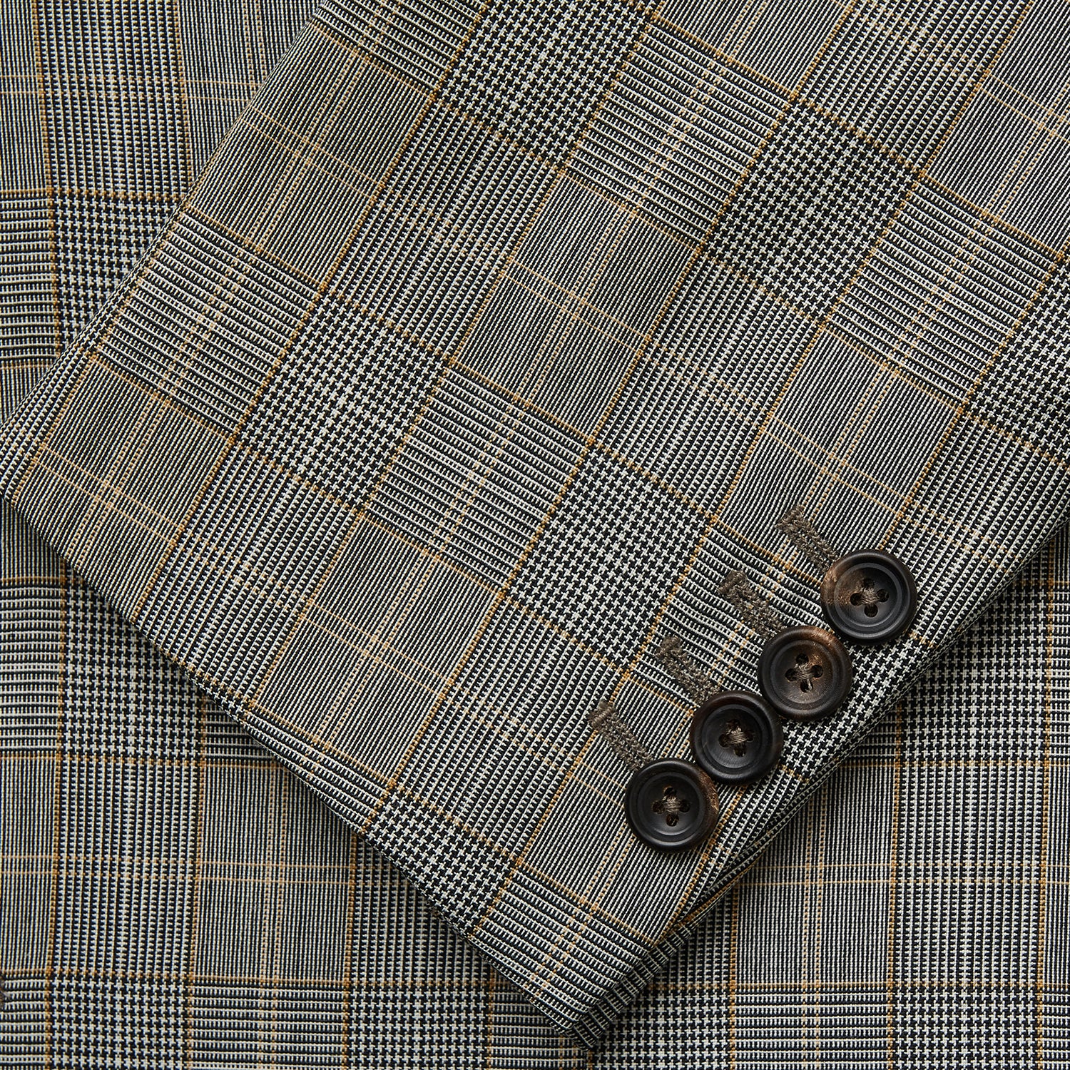View 3 of product The Turnbull & Asser Beige Wool Prince-of-Wales Check Jacket is a single-breasted blazer with a notched lapel, one-button closure, two front flap pockets, and sleeve button details—an ideal lightweight summer jacket.