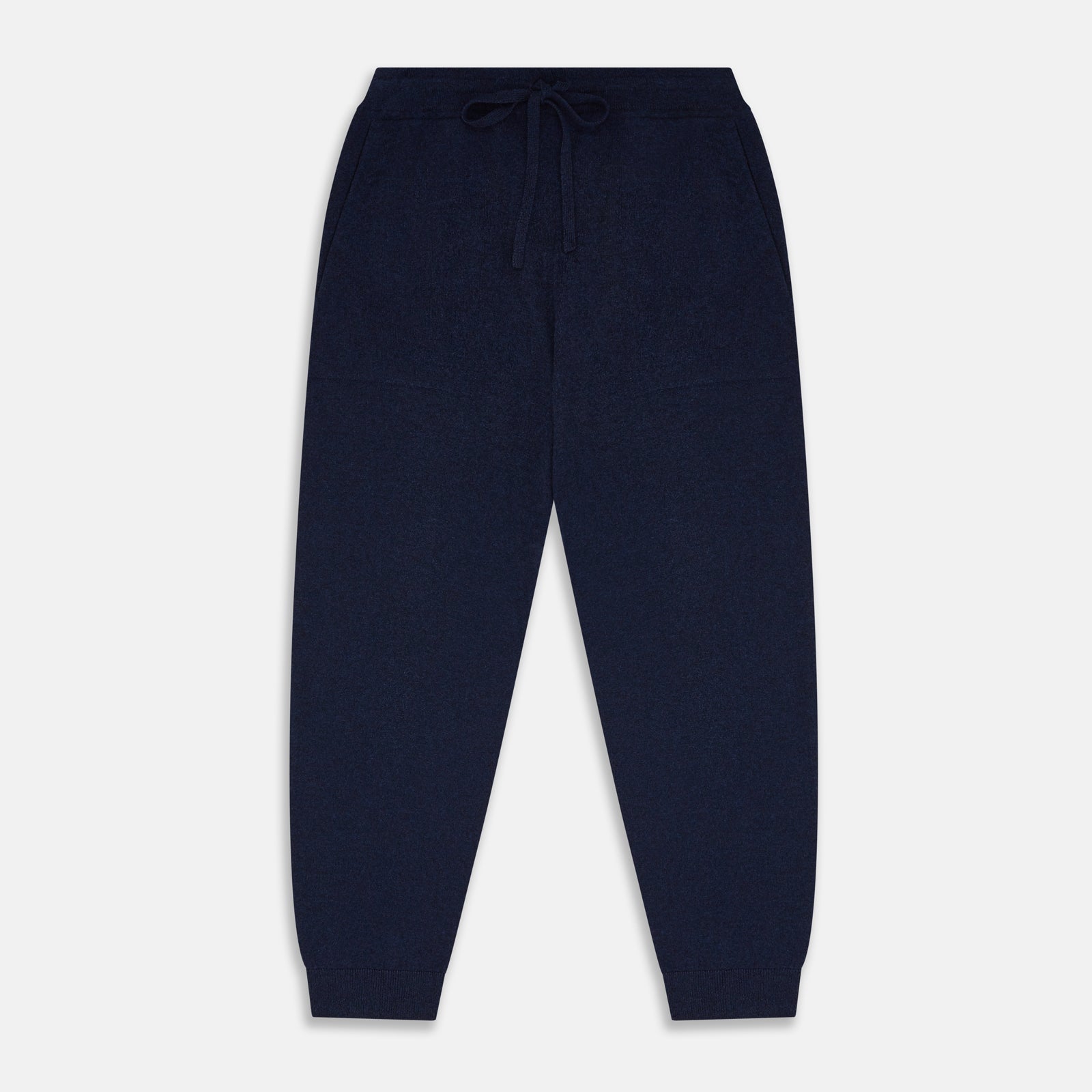 View 1 of product The Navy Cashmere Knitted Lounge Pyjama Trousers by Turnbull & Asser feature a contemporary fit, elastic waistband with drawstring, side pockets, and fitted cuffs, shown laid flat on a white background.
