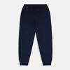View 3 of product The Navy Cashmere Knitted Lounge Pyjama Trousers by Turnbull & Asser feature a contemporary fit, elastic waistband with drawstring, side pockets, and fitted cuffs, shown laid flat on a white background.
