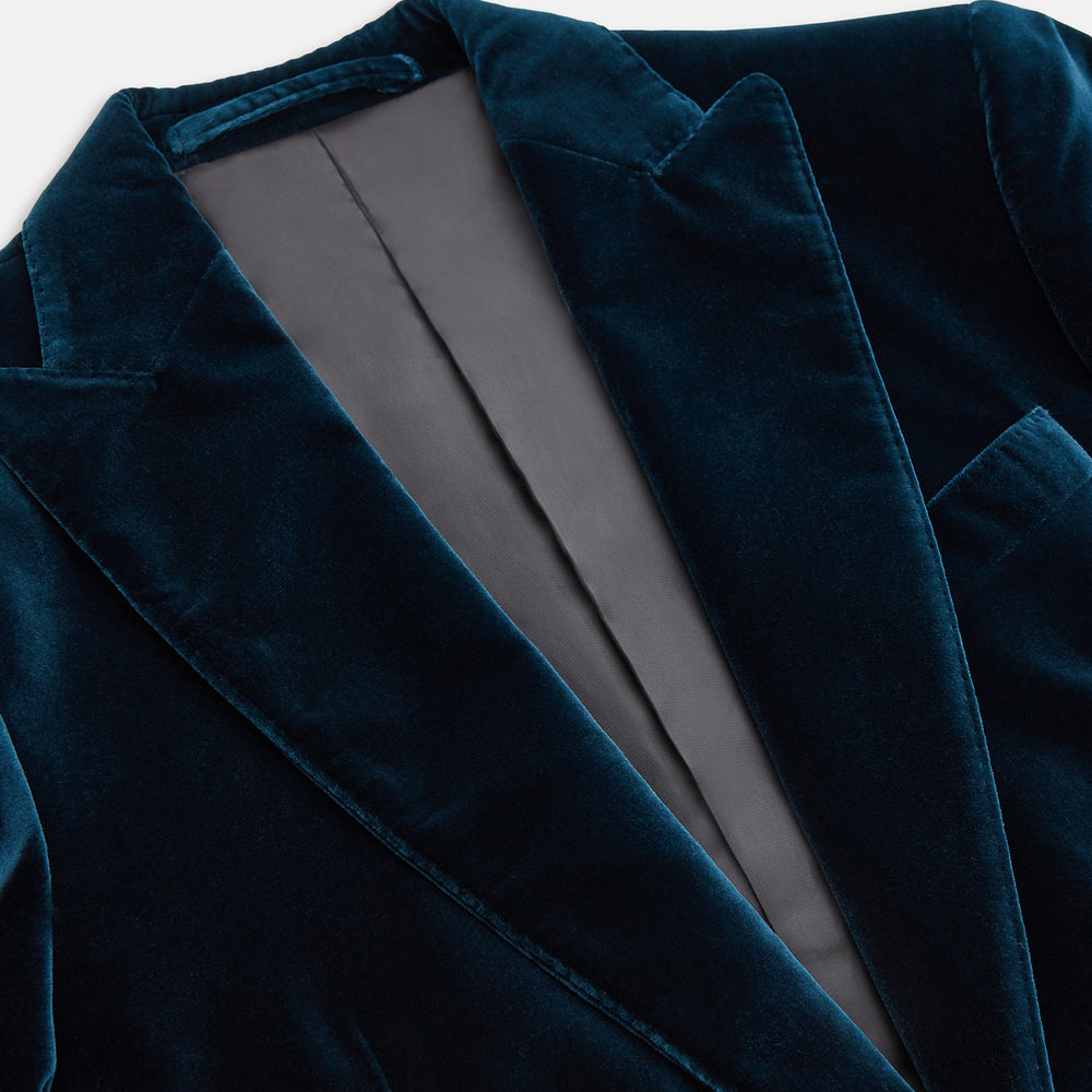 The Turnbull & Asser Teal Velvet Single Breasted Blazer features a single button closure, notched lapels, and front flap pockets, shown against a plain white background.