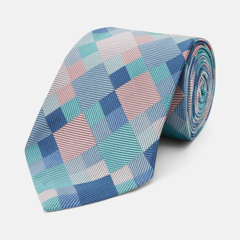The Green Multi Pixel Silk Tie by Turnbull & Asser features a checked pattern in blue, teal, and pink on a light background, with diagonal stripes in each square for added texture.