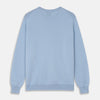 View 3 of product The Pale Blue Cashmere Glenn Jumper by Turnbull & Asser is laid flat against a white background. This men's crew neck essential features ribbed cuffs, hem, and neckline for timeless style.