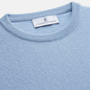View 2 of product The Pale Blue Cashmere Glenn Jumper by Turnbull & Asser is laid flat against a white background. This men's crew neck essential features ribbed cuffs, hem, and neckline for timeless style.