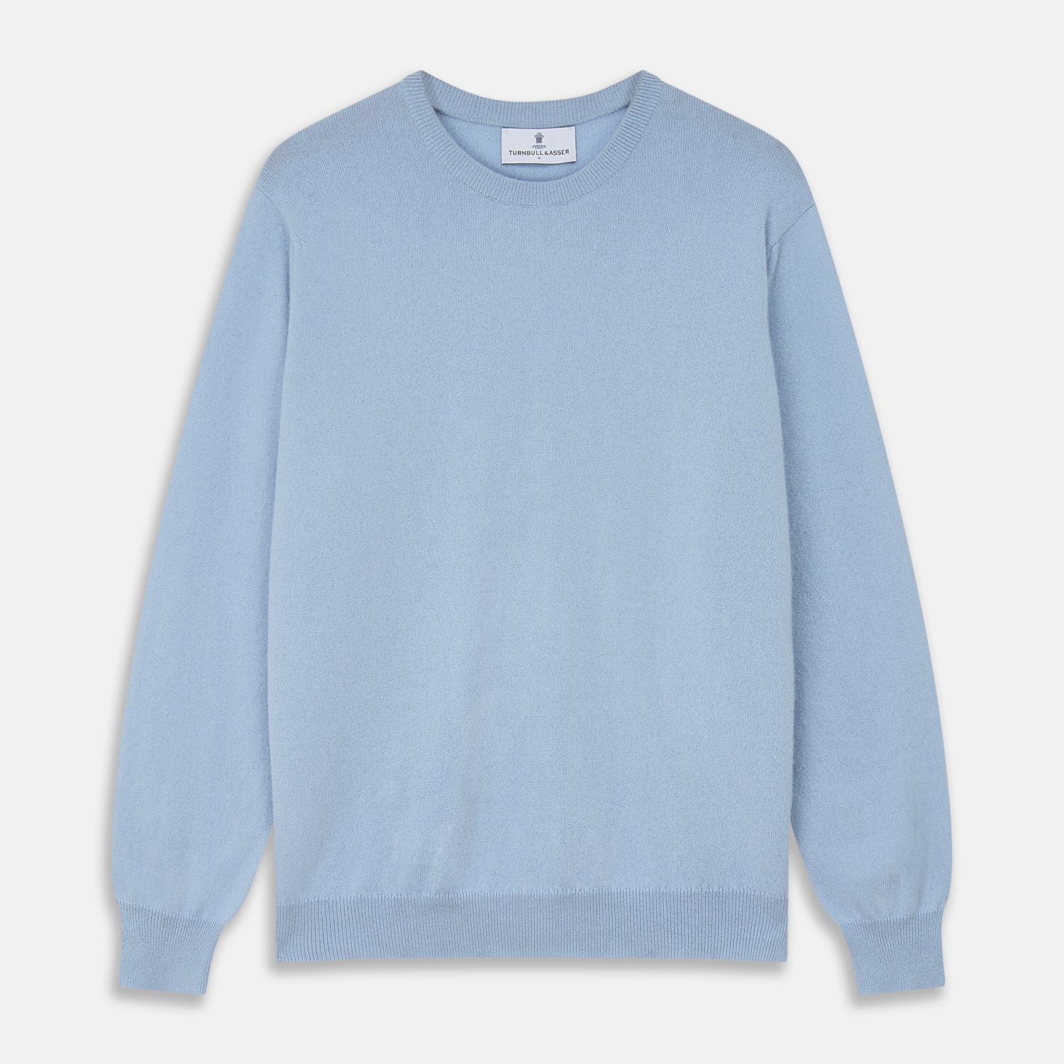 View 1 of product The Pale Blue Cashmere Glenn Jumper by Turnbull & Asser is laid flat against a white background. This men's crew neck essential features ribbed cuffs, hem, and neckline for timeless style.