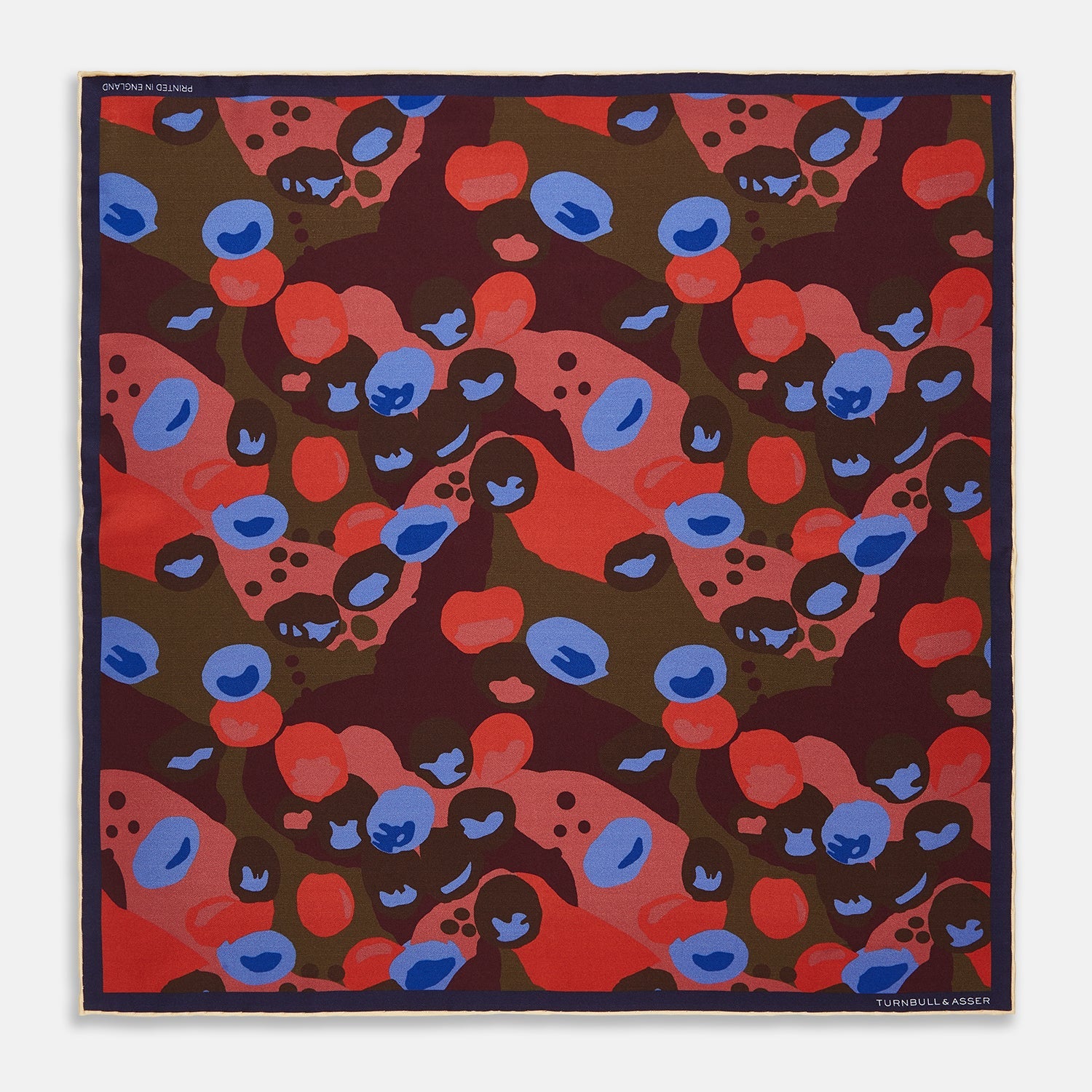 View 1 of product The Turnbull & Asser Green, Burgundy, and Pink Abstract Olives Silk Pocket Square features an abstract olive pattern with bold colors, a border, and corner text. Made in England.