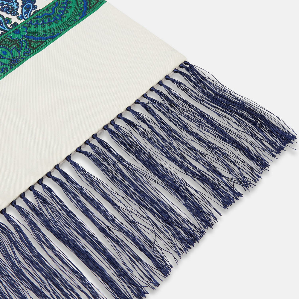 The Turnbull & Asser Green and Blue Paisley Silk Scarf features a blue and green paisley print on white, a solid cream section, a green stripe, and navy fringed ends.