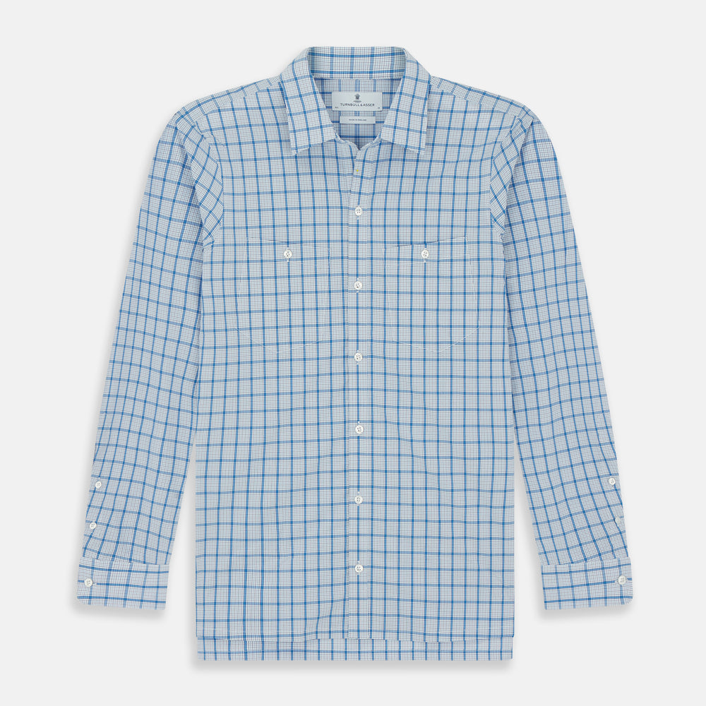 The Turnbull & Asser Blue Graph Overlay Check Piccadilly Shirt is a breathable cotton button-up featuring a collar, two chest pockets, white buttons, and an elegant blue graph check—perfect for the holidays.