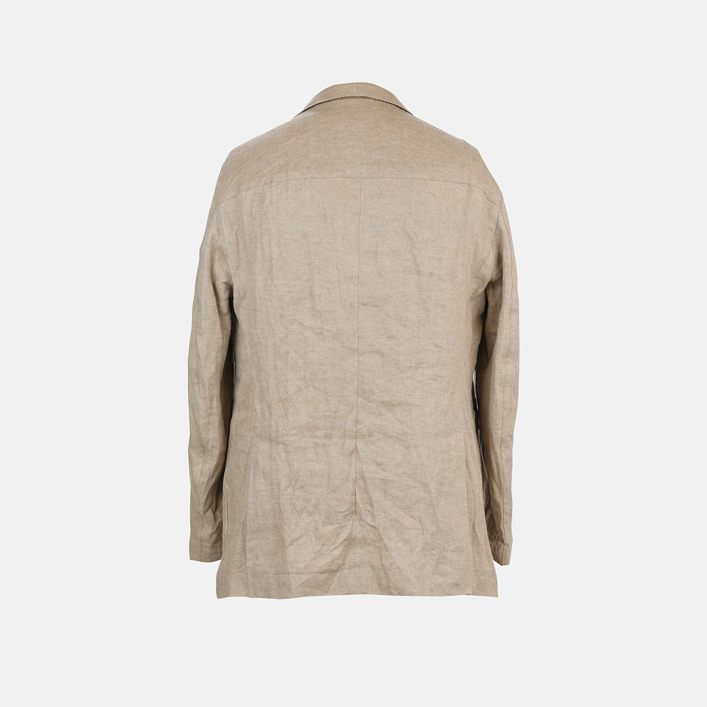 The Riviera Sand Oversized Blazer in Linen by Turnbull & Asser UK is showcased against a crisp white background. Featuring a relaxed, oversized silhouette in beige linen with two brown buttons, three front pockets, and a dark lining, this piece is perfect for effortless summer dressing.