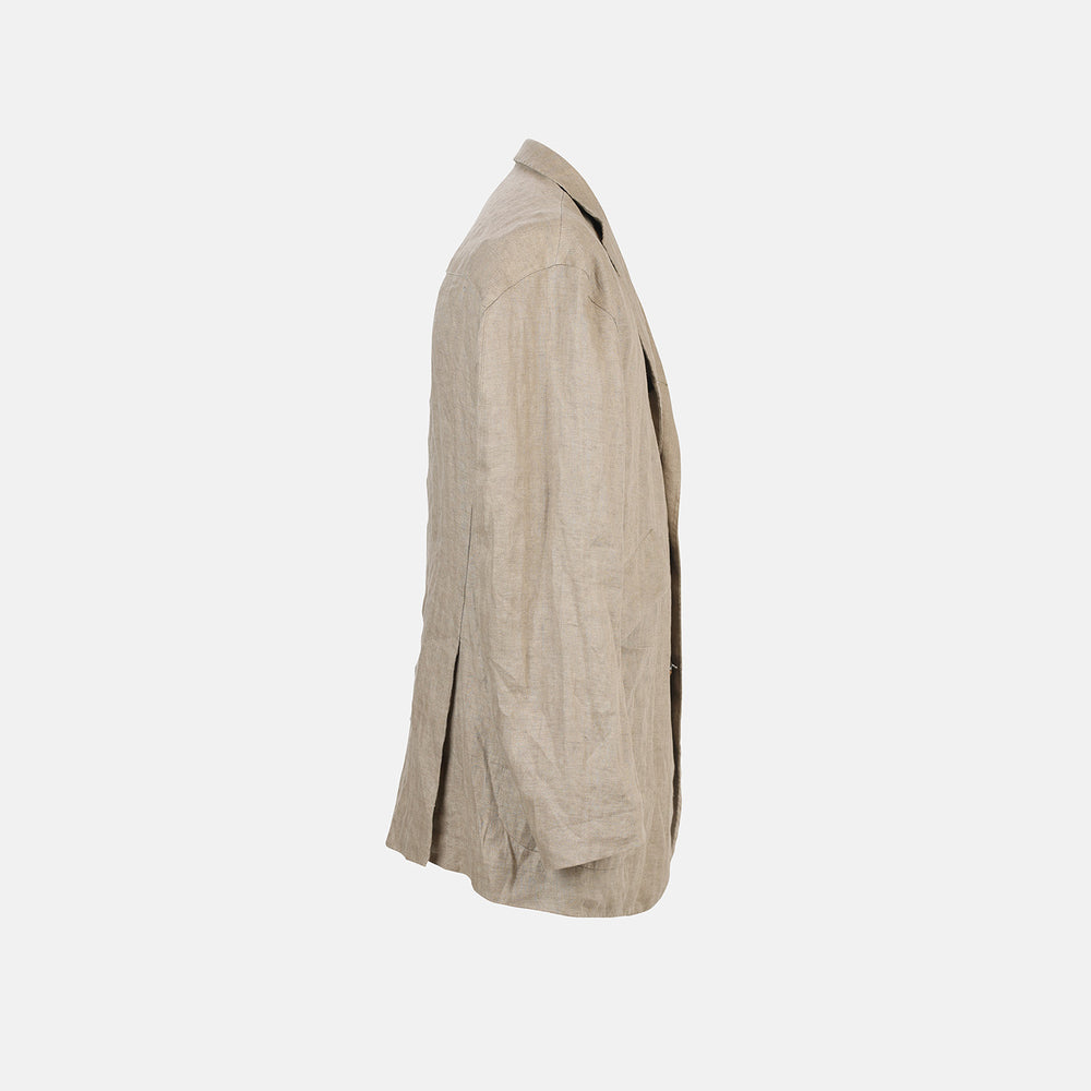 The Riviera Sand Oversized Blazer in Linen by Turnbull & Asser UK is showcased against a crisp white background. Featuring a relaxed, oversized silhouette in beige linen with two brown buttons, three front pockets, and a dark lining, this piece is perfect for effortless summer dressing.