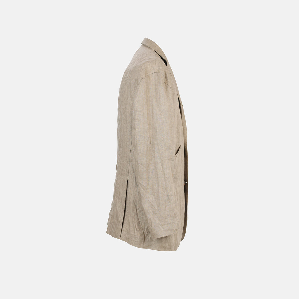 The Riviera Sand Oversized Blazer in Linen by Turnbull & Asser UK is showcased against a crisp white background. Featuring a relaxed, oversized silhouette in beige linen with two brown buttons, three front pockets, and a dark lining, this piece is perfect for effortless summer dressing.