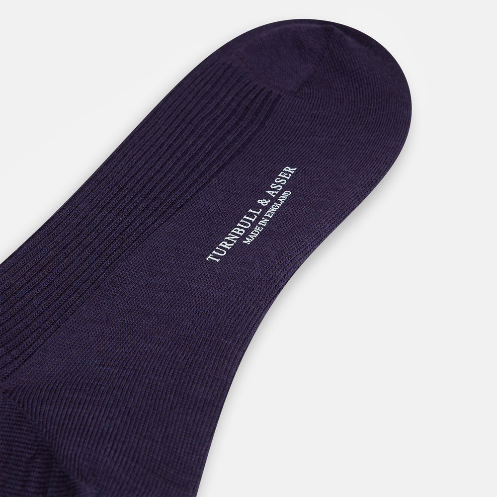 A single Dark Purple Mid-Length Merino Sock from Turnbull & Asser is shown upright on a plain white background, highlighting its ribbed texture.