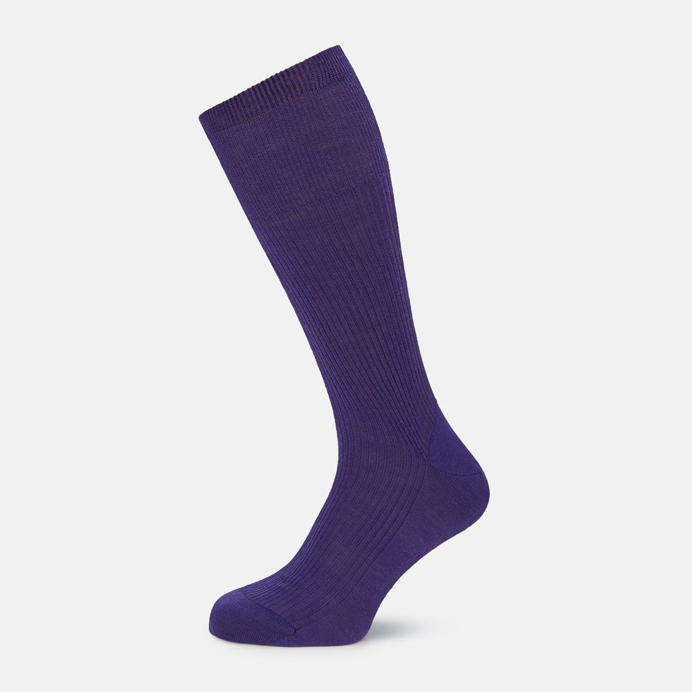 The Turnbull & Asser Violet Mid-Length Merino Socks, crafted from luxurious merino wool, feature a knee-high ribbed design and are shown upright against a plain white background.