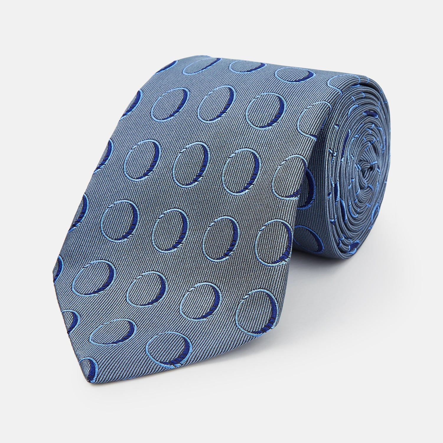 View 1 of product The Turnbull & Asser Die Another Day Circle Silk Tie, as seen on James Bond, features large dark blue ovals on a lighter blue background.