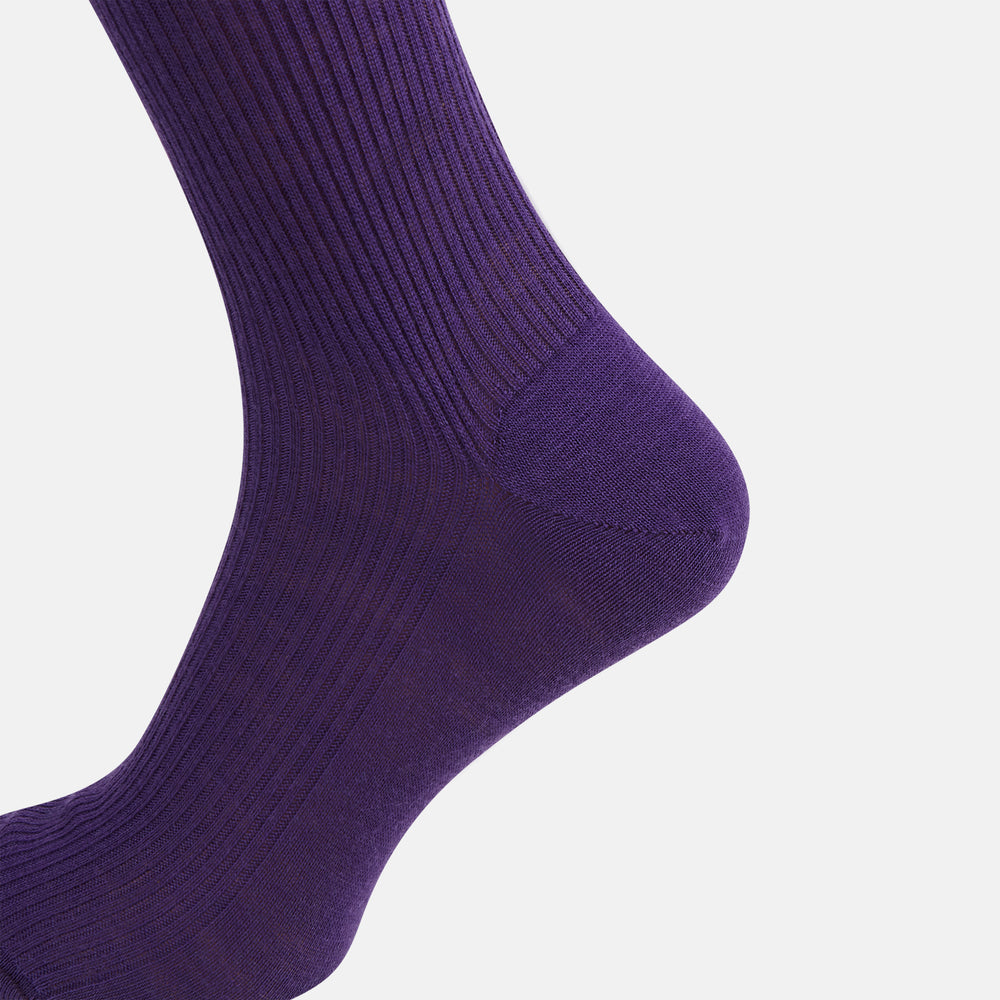 A single Turnbull & Asser Purple Mid-Length Merino Sock stands upright with the foot slightly raised against a plain white background.