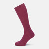 View 1 of product A single Turnbull & Asser Mauve Mid-Length Merino Sock is shown upright, foot angled downward, against a plain light gray background. The ribbed sock features a solid mauve color.