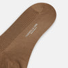 View 3 of product A single Turnbull & Asser Camel Mid-Length Merino Sock stands upright on a plain white background, showcasing its ribbed texture and reinforced toe and heel.