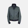 View 1 of product A Fairway Ash Grey Driving Jacket in Cotton by Turnbull & Asser UK, featuring a zip-up front, high collar, chest and side zip pockets, and dark ribbed cuffs and waistband; crafted from lightweight cotton for comfort and style, displayed on a plain white background.