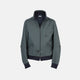 A Fairway Ash Grey Driving Jacket in Cotton by Turnbull & Asser UK, featuring a zip-up front, high collar, chest and side zip pockets, and dark ribbed cuffs and waistband; crafted from lightweight cotton for comfort and style, displayed on a plain white background.