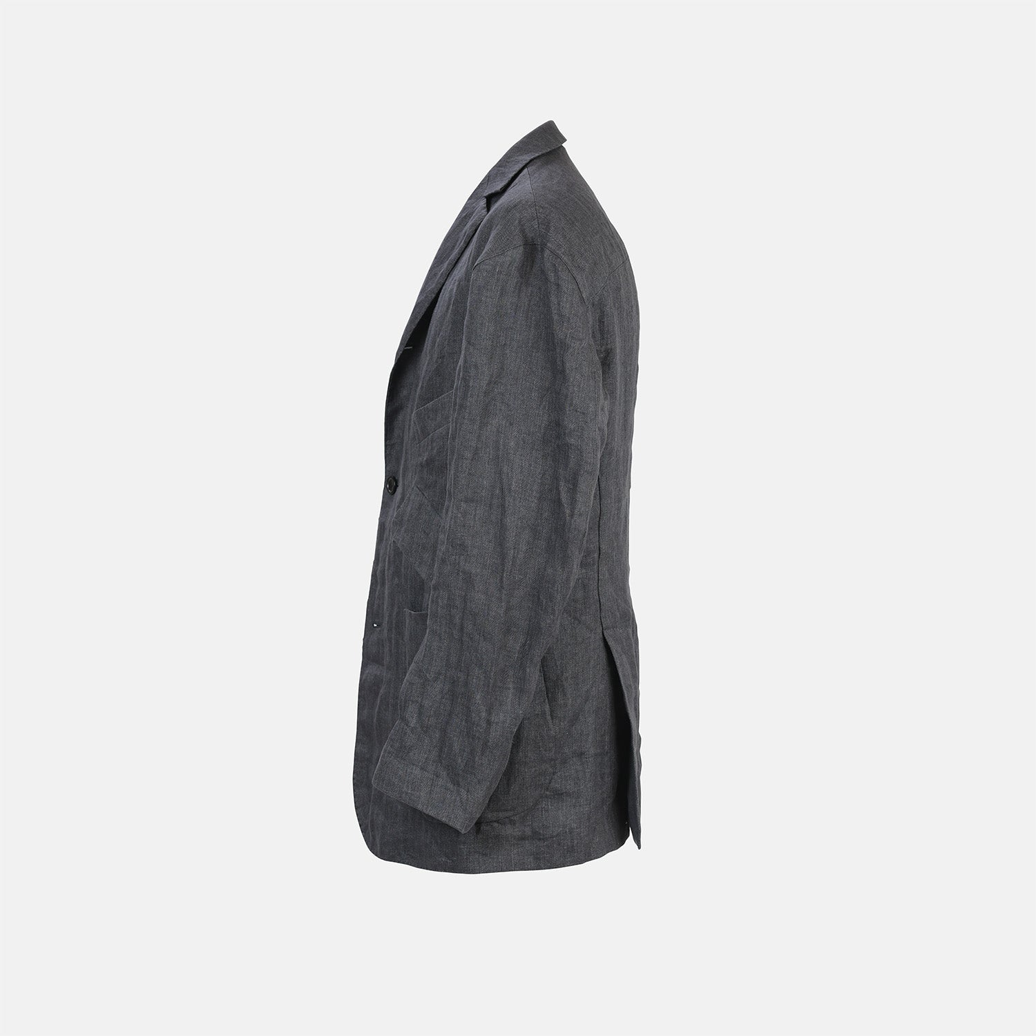 View 3 of product The Riviera Ash Oversized Blazer in Linen by Turnbull & Asser UK, showcased against a plain white background, features a single-breasted design in dark gray linen—ideal for summer tailoring—with two front buttons and large flap pockets. This jacket seamlessly combines classic style with breathable comfort.