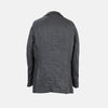 View 2 of product The Riviera Ash Oversized Blazer in Linen by Turnbull & Asser UK, showcased against a plain white background, features a single-breasted design in dark gray linen—ideal for summer tailoring—with two front buttons and large flap pockets. This jacket seamlessly combines classic style with breathable comfort.
