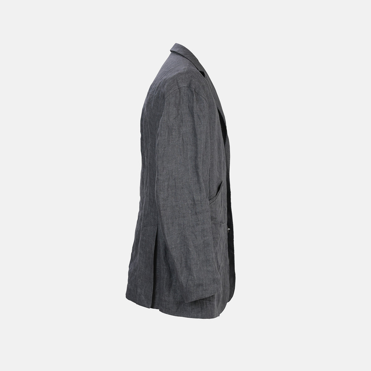View 6 of product The Riviera Ash Oversized Blazer in Linen by Turnbull & Asser UK, showcased against a plain white background, features a single-breasted design in dark gray linen—ideal for summer tailoring—with two front buttons and large flap pockets. This jacket seamlessly combines classic style with breathable comfort.