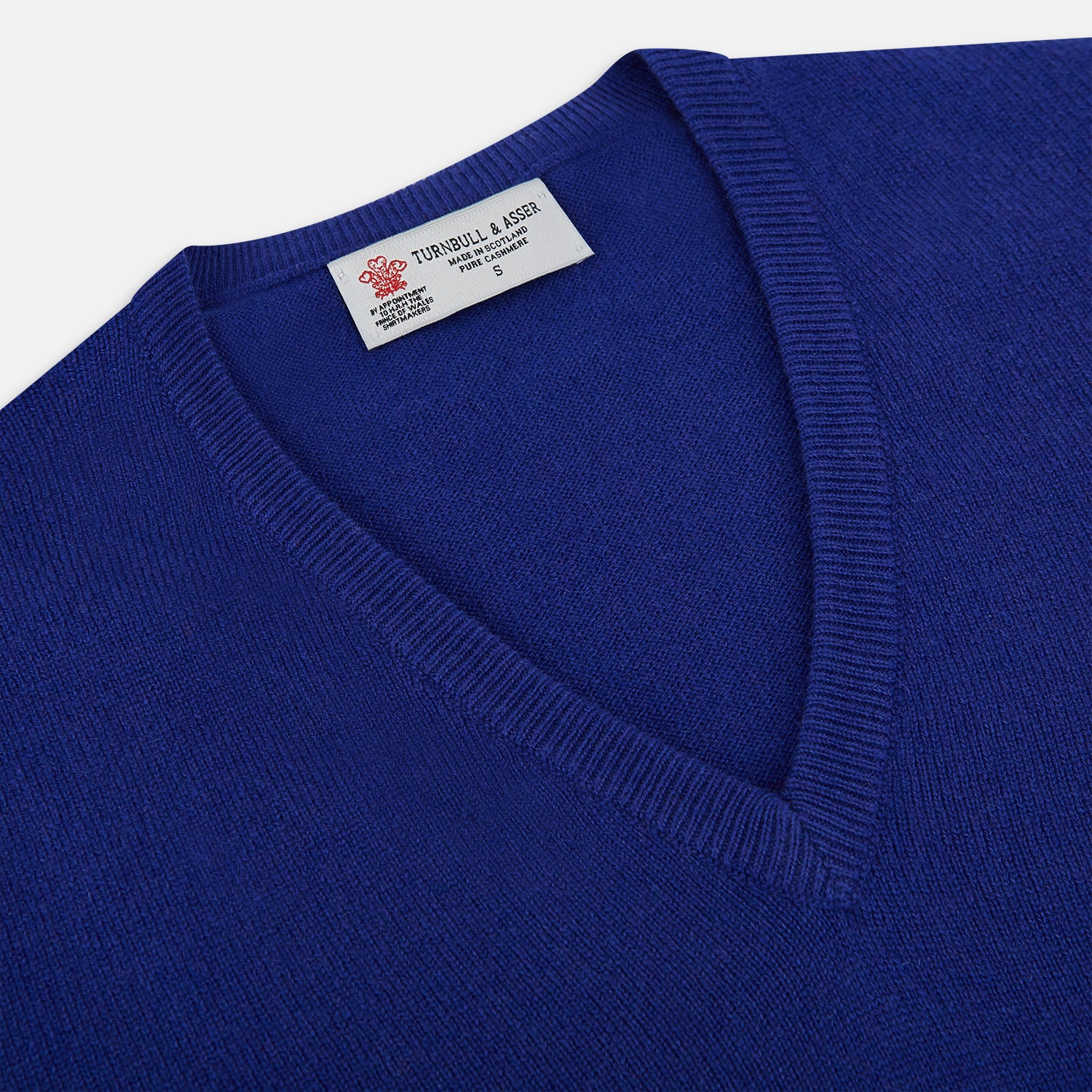 View 2 of product The Royal Blue long-sleeve V-neck jumper in cashmere from Turnbull & Asser UK is displayed against a white background.