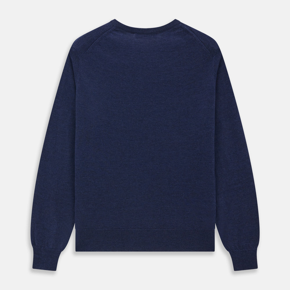 The Blue Crew Neck Merino Wool Jumper by Turnbull & Asser—a classic, long-sleeved staple with ribbed cuffs and hem—lies flat against a white background.