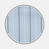 View 1 of product A close-up of Turnbull & Asser's BESPOKE FABRIC 1143 39—light blue with white and dark gray pinstripes—shown in a circular frame on white, ideal for custom shirts with refined monogram styles.