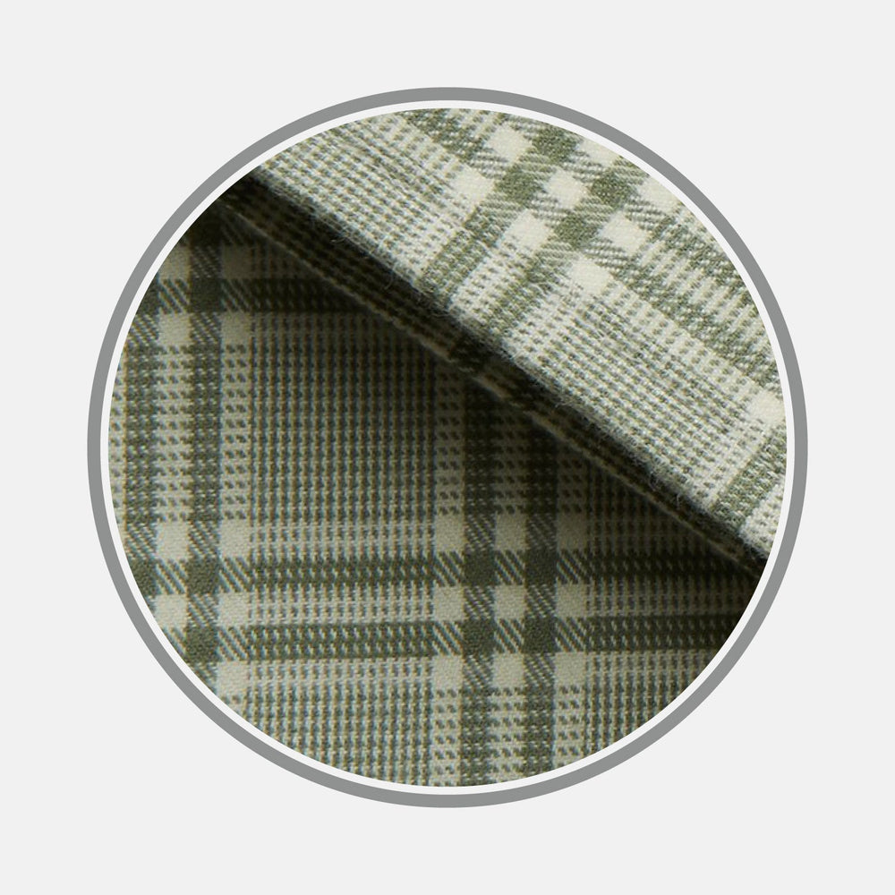 Close-up of BESPOKE FABRIC 1173 08 by Turnbull & Asser—a green and white plaid with intersecting lines in a checkered pattern, shown in a circular frame on a light gray background. Ideal for crafting your next custom shirt.