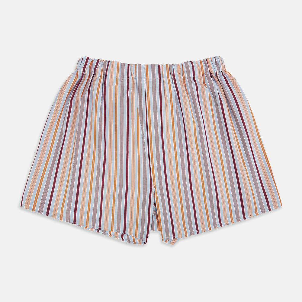 Orange and burgundy striped cotton boxer shorts by Turnbull & Asser UK, featuring a relaxed fit and an elastic waistband. The vertical stripes incorporate shades of orange, burgundy, yellow, and blue, and are displayed against a white background.