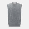 View 1 of product Turnbull & Asser UK’s marl grey sleeveless V-neck vest in cashmere, featuring a ribbed hem and crafted from soft knit fabric, is showcased against a plain white background.